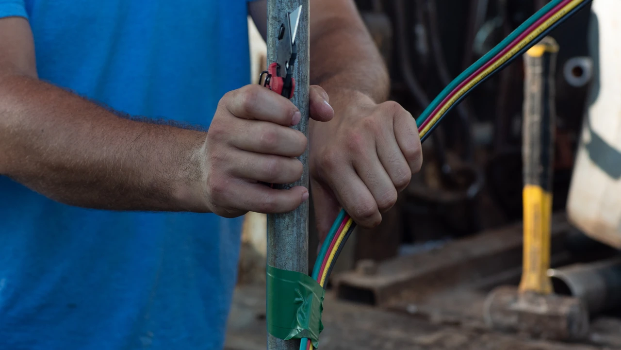 A Summers Well Drilling crew pulling a well pump to repair